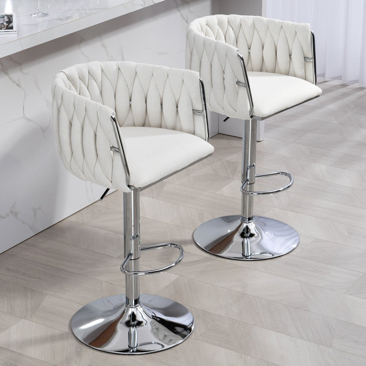 w2215p184992 - Two beige swivel bar stools shown at an angle beside a kitchen island