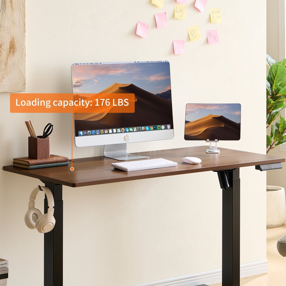 Standing desk load-capacity graphic showing a computer workstation