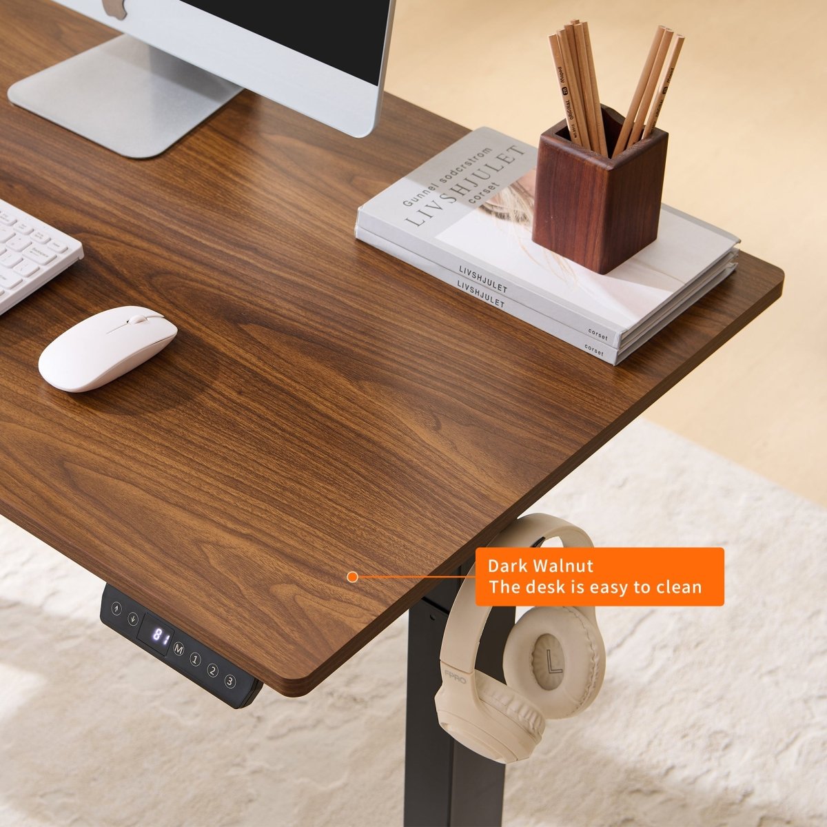Walnut-look desktop close-up with memory controls and headphone hook