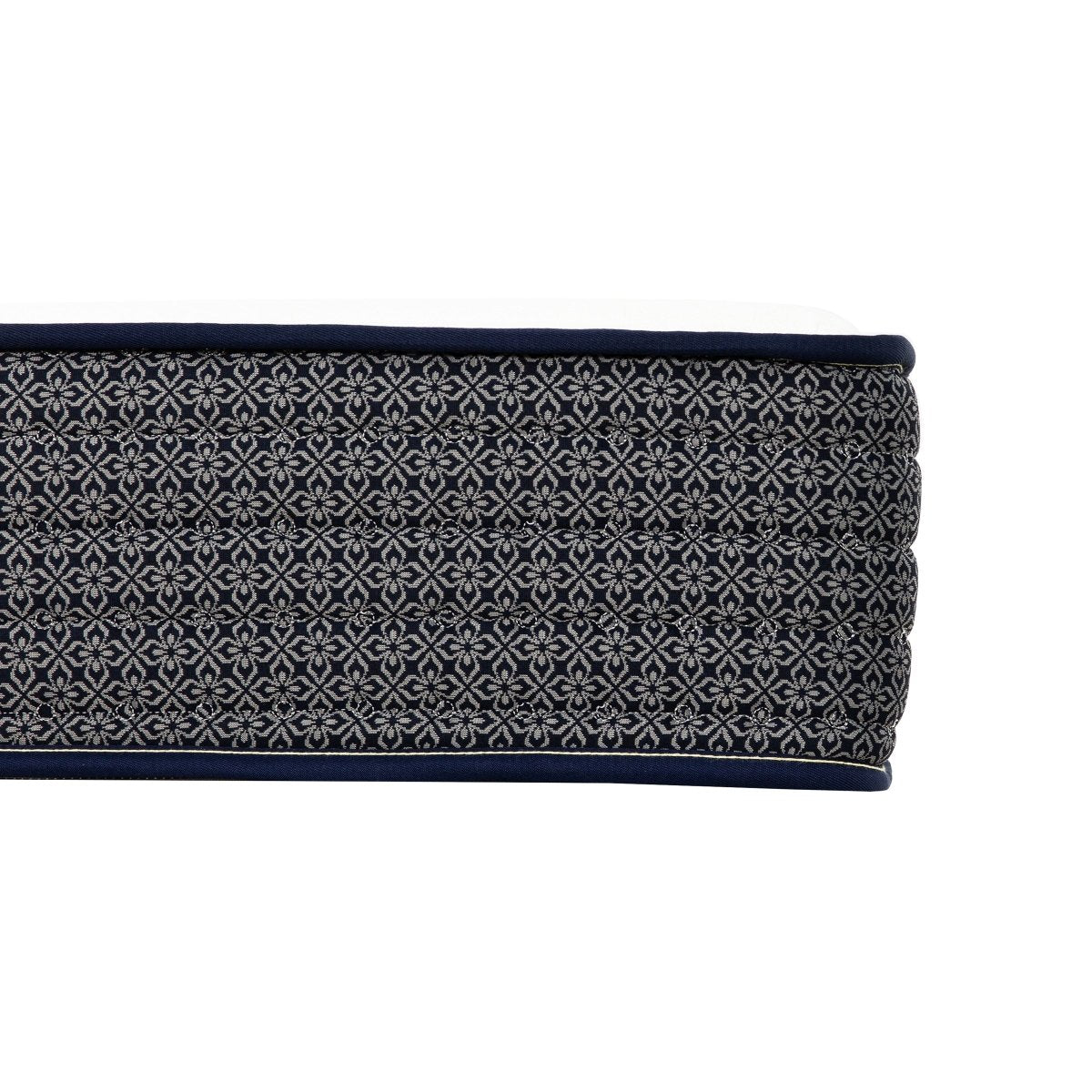 Detailed side view of the Polar Hybrid TT mattress showing the repeating dark gray fabric pattern and stitched surface.