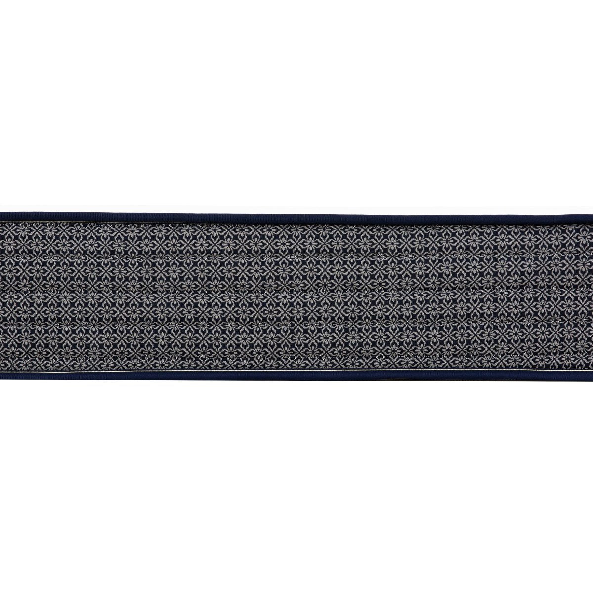 Detailed side view of the Polar Hybrid TT mattress showing the repeating dark gray fabric pattern and stitched surface.