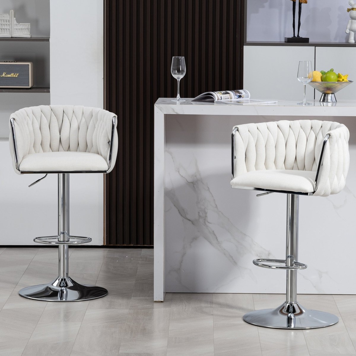 w2215p184992 - Two beige swivel bar stools styled beside a marble kitchen island